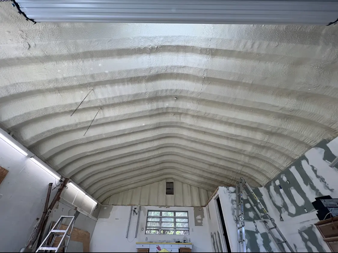 Spray polyurethane foam applied to the underside of a metal roof deck in Lake City